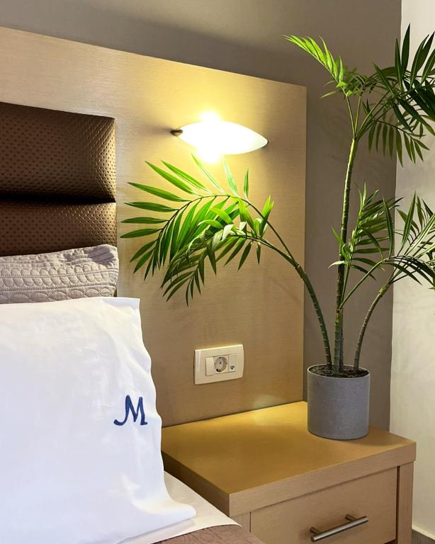 Postel nebo postele na pokoji v ubytování Maria Resort Parga