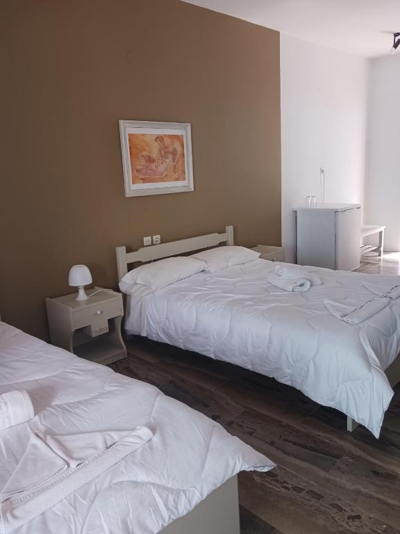 Postel nebo postele na pokoji v ubytování Soulis Hotel