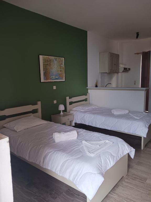 Postel nebo postele na pokoji v ubytování Soulis Hotel