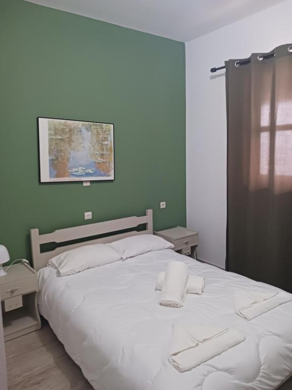 Postel nebo postele na pokoji v ubytování Soulis Hotel