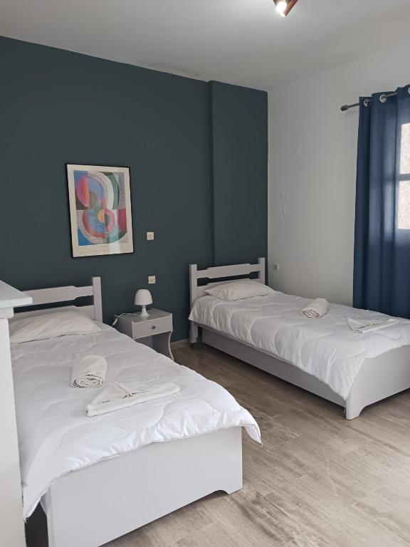 Postel nebo postele na pokoji v ubytování Soulis Hotel