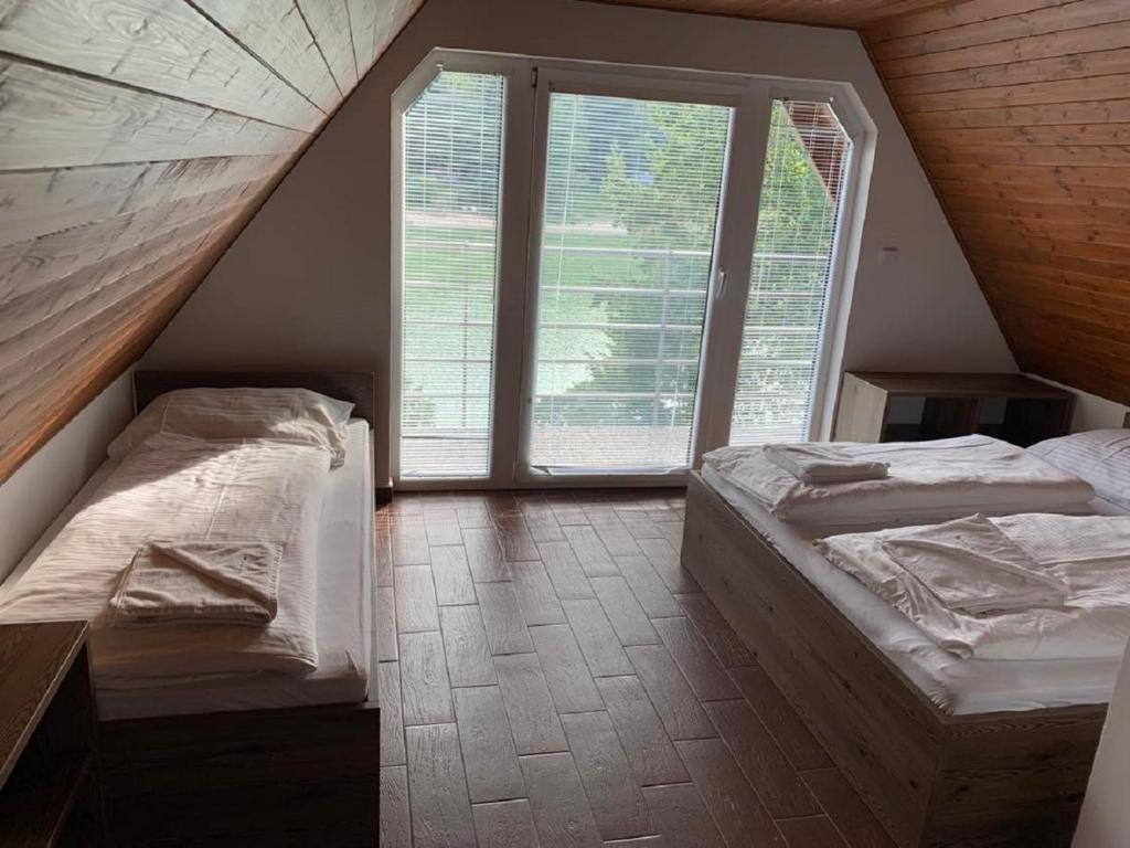 Postel nebo postele na pokoji v ubytování Chata Holiday