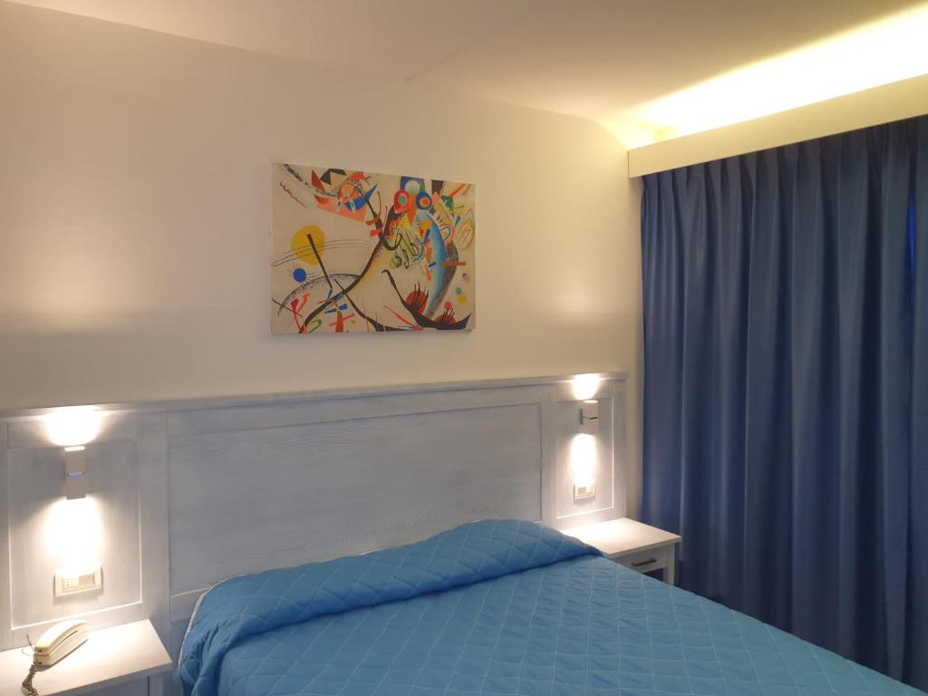 Postel nebo postele na pokoji v ubytování Hotel Le Tre Isole