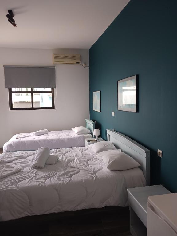 Postel nebo postele na pokoji v ubytování Soulis Hotel