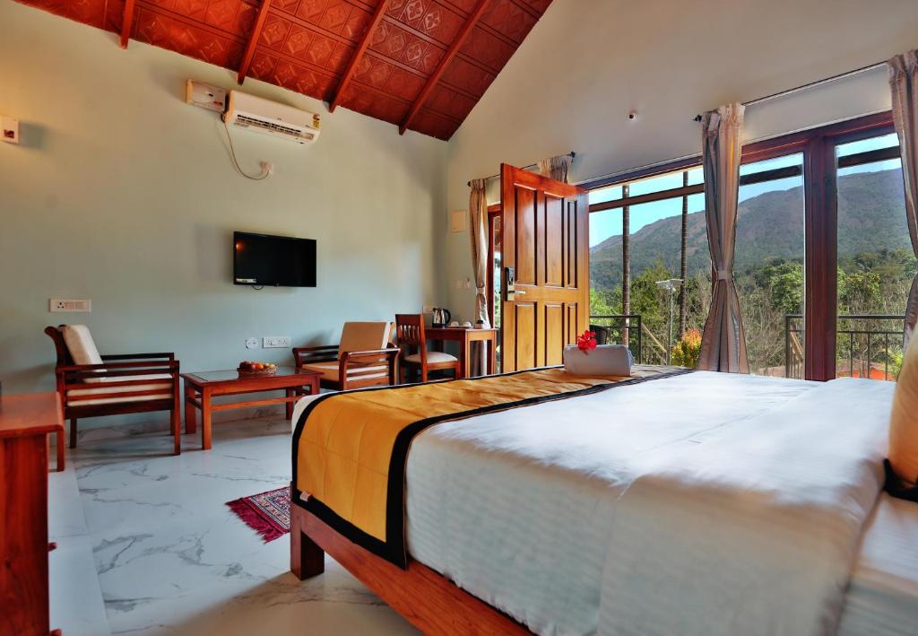 Postel nebo postele na pokoji v ubytování Hill Crest Resort - Coorg