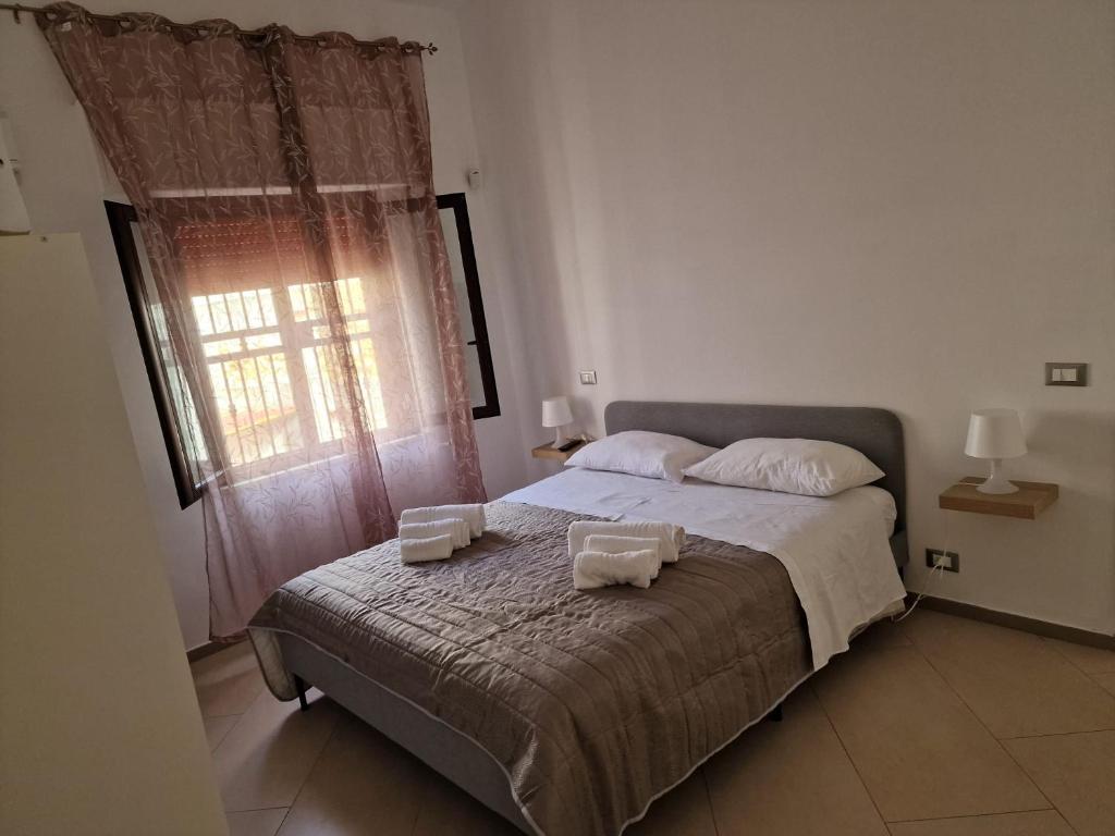 Postel nebo postele na pokoji v ubytování Casa Poseidonia - intero alloggio in riva al mare