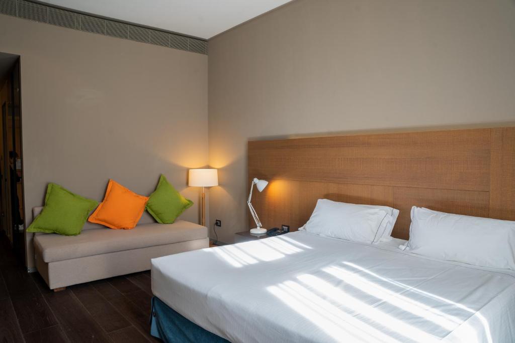 Postel nebo postele na pokoji v ubytování Grand Hotel Billia