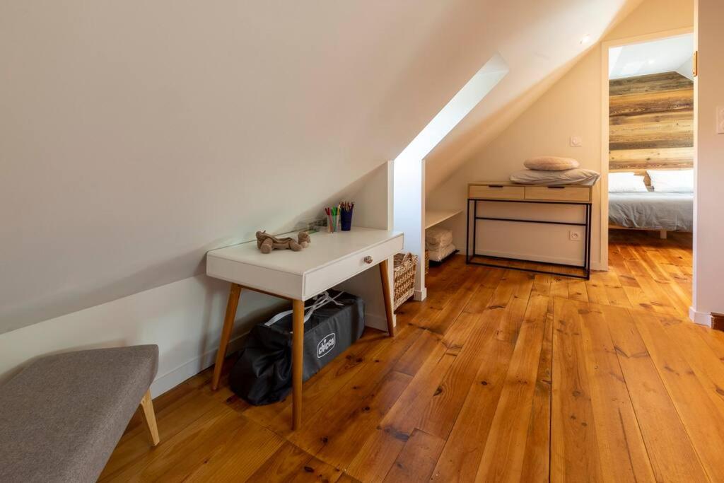 an attic room with a sink and a bed at Gîte d&#39;AURE. Classé en meublé 4 étoiles. 