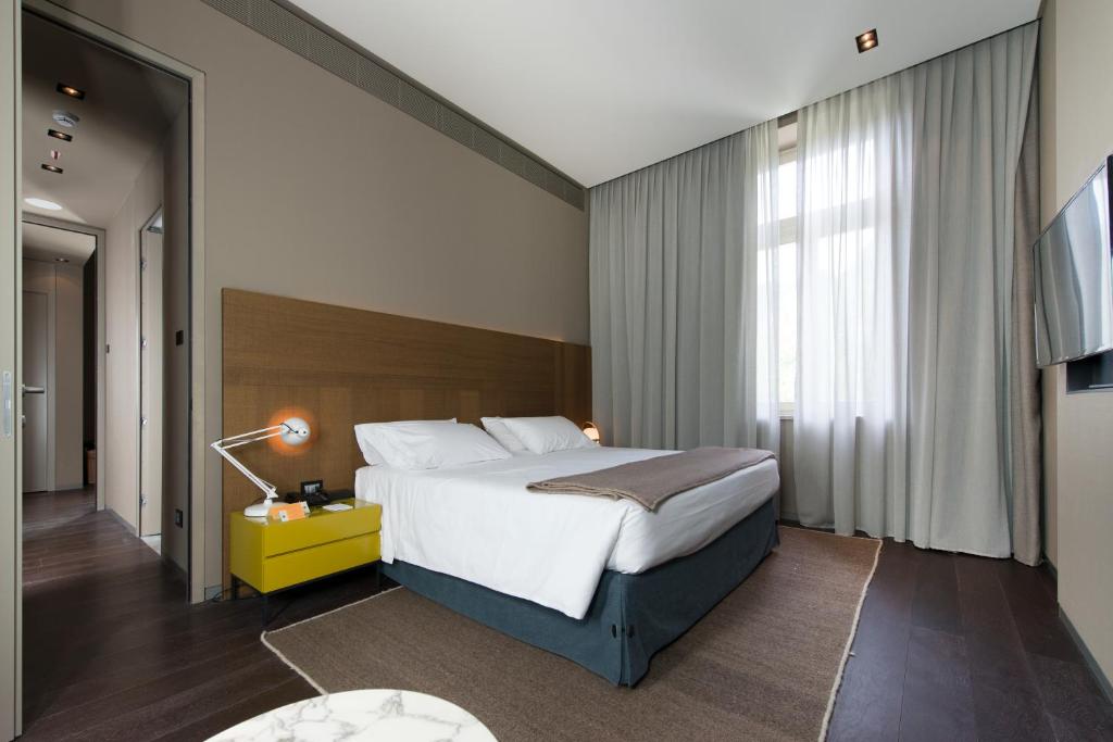 Postel nebo postele na pokoji v ubytování Grand Hotel Billia