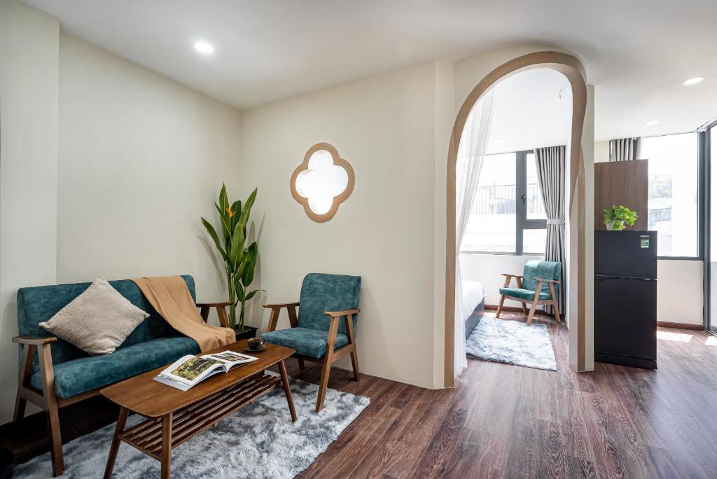 a living room with a couch and a table at Jan Hostel Central Point in Ho Chi Minh City