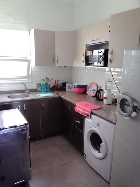 Kuchyň nebo kuchyňský kout v ubytování Chalet 2 BDs 2 BRs at Second Floor for rent at Amwaj Sidi Abdelrahman for families ONLY and NOT Including Gate and Beach Pass fees