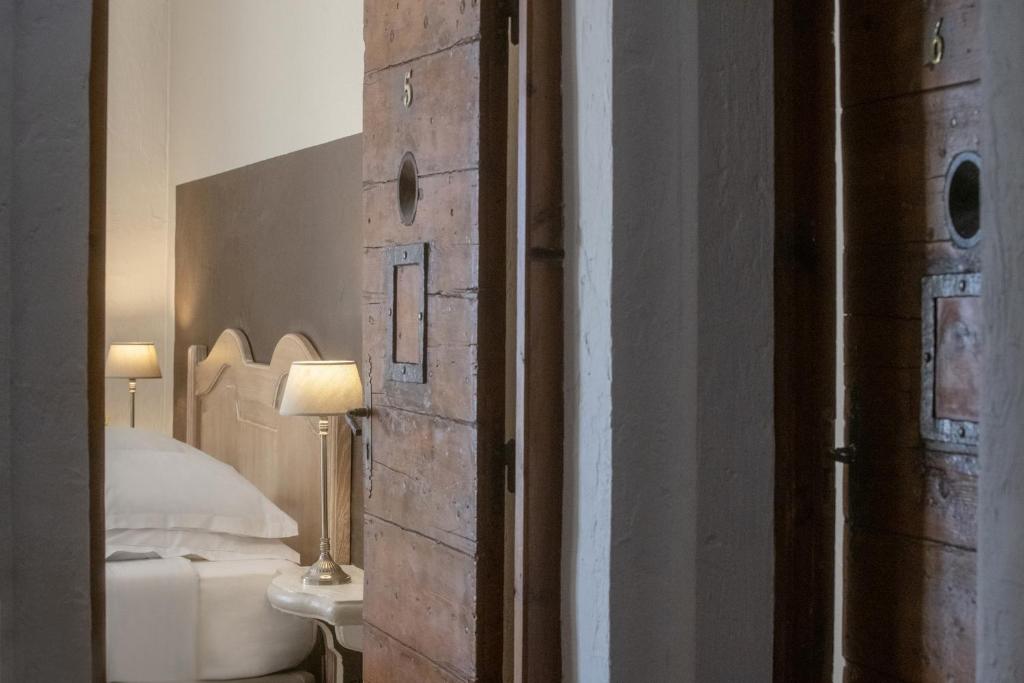 Postel nebo postele na pokoji v ubytování Hotel Les Messugues