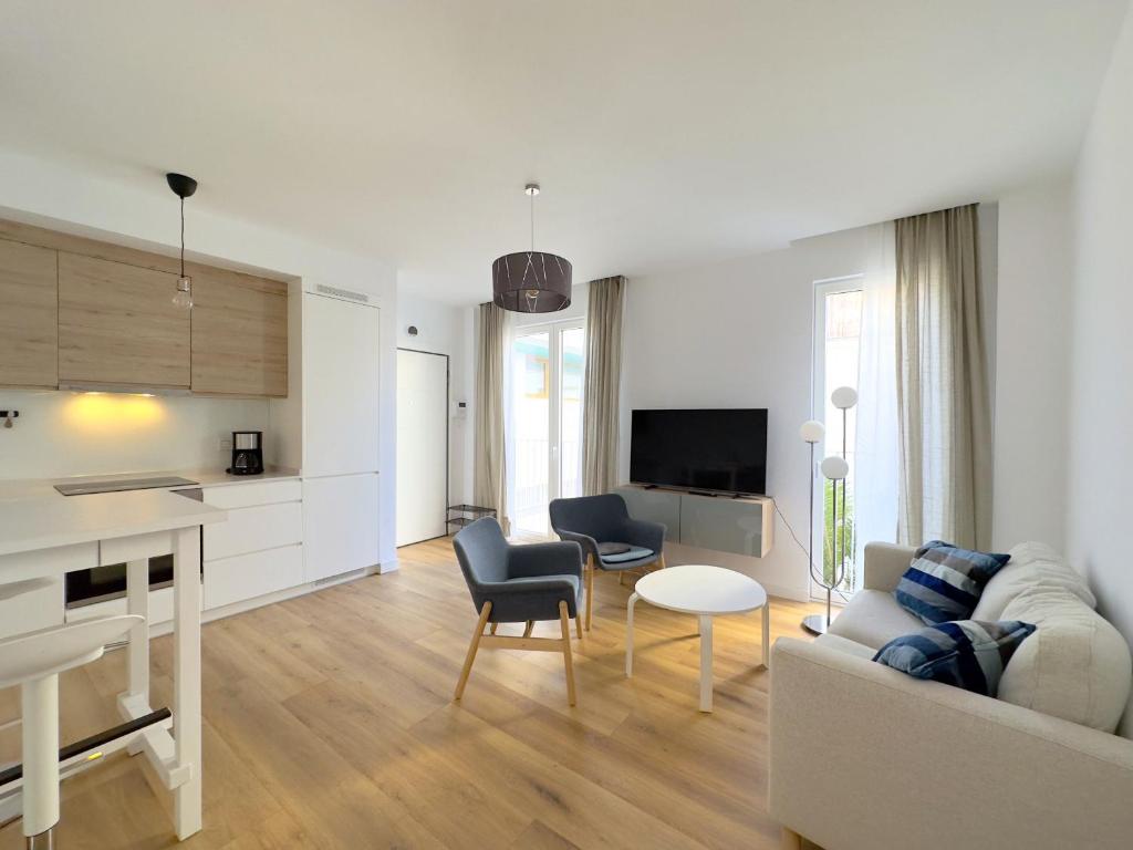 Televízia a/alebo spoločenská miestnosť v ubytovaní JUAN DE AUSTRIA Duplex Penthouse 4PAX