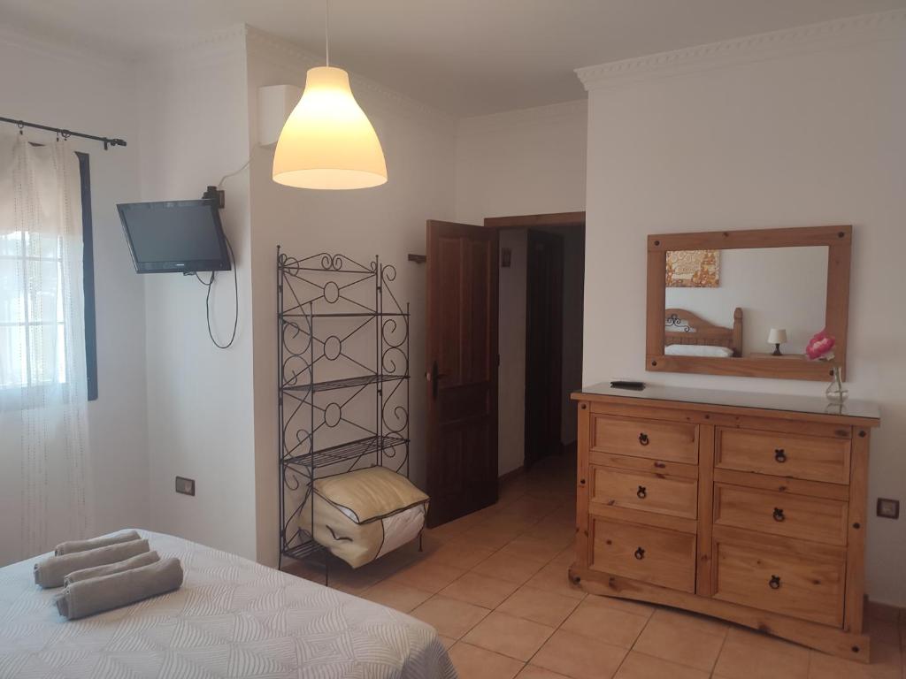 A bed or beds in a room at Chalet Santi Playa de la Barrosa