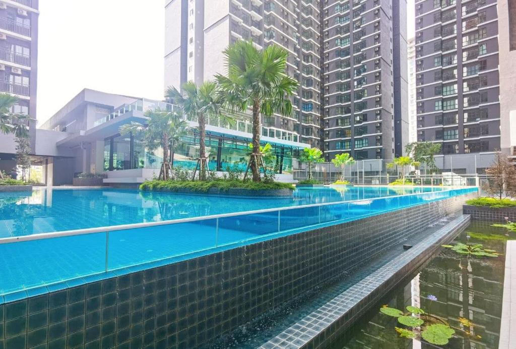 a swimming pool in a city with tall buildings at rumaKL at Majestic Maxim in Kuala Lumpur
