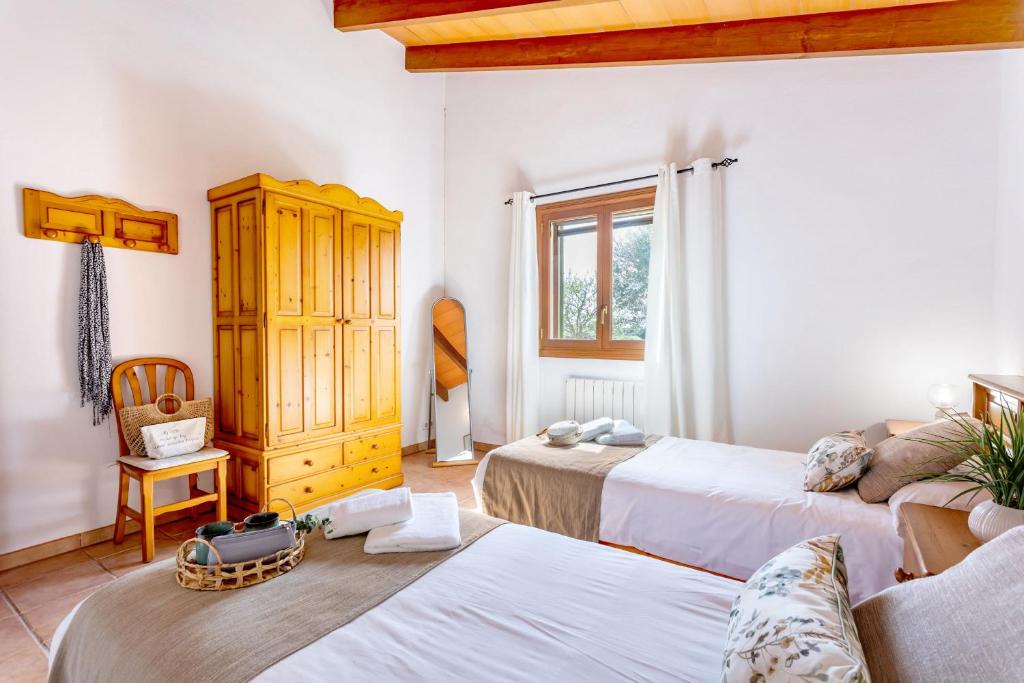 A bed or beds in a room at Son Garrot by dracmallorca