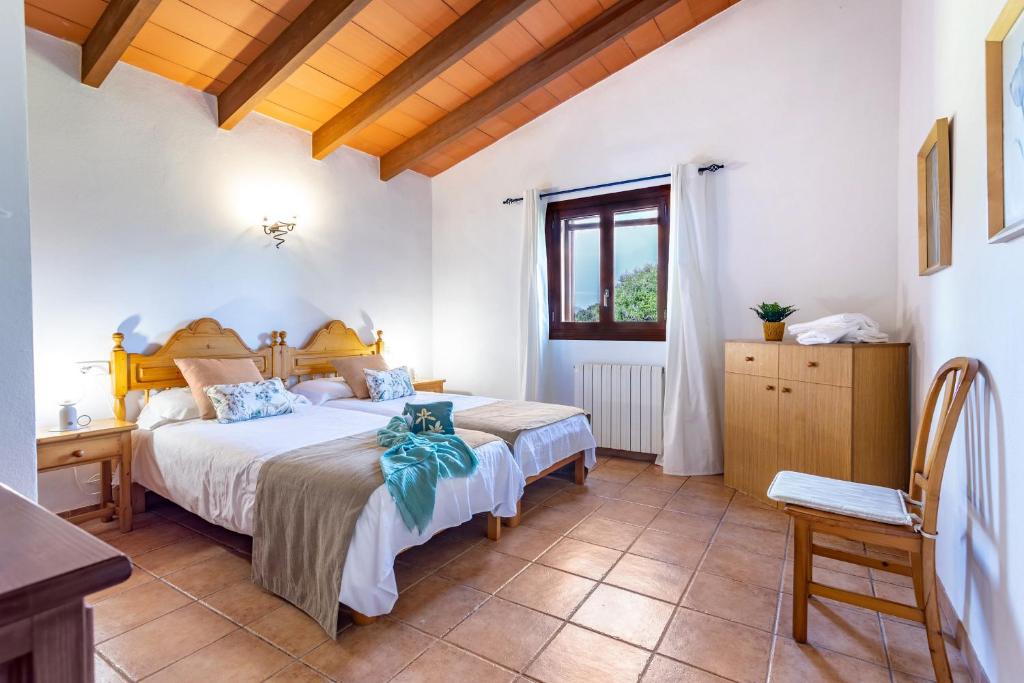 A bed or beds in a room at Son Garrot by dracmallorca