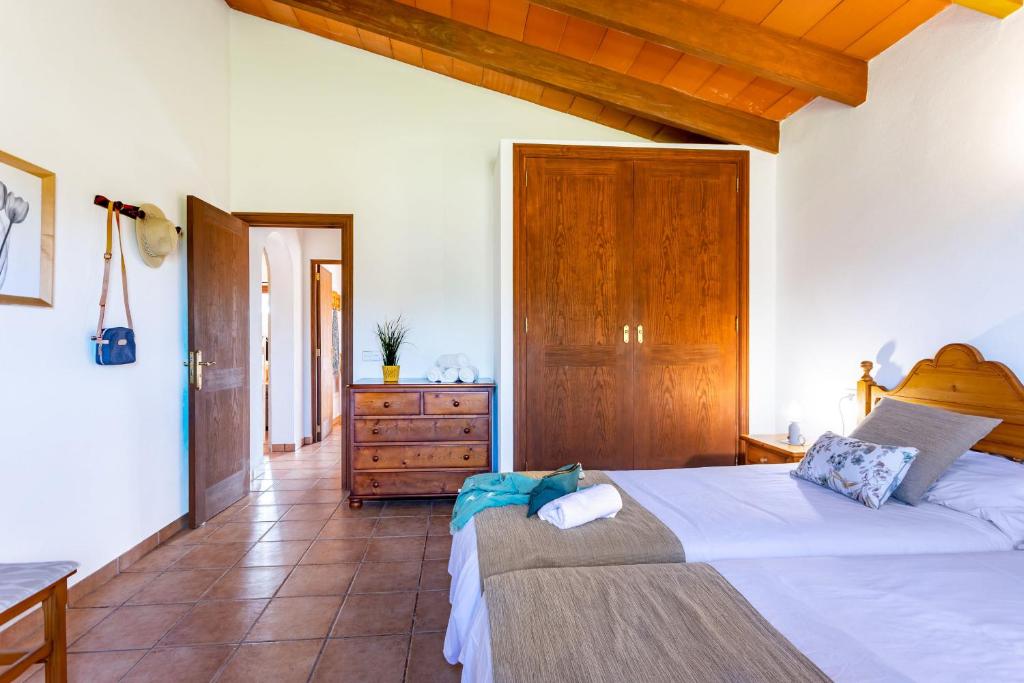A bed or beds in a room at Son Garrot by dracmallorca