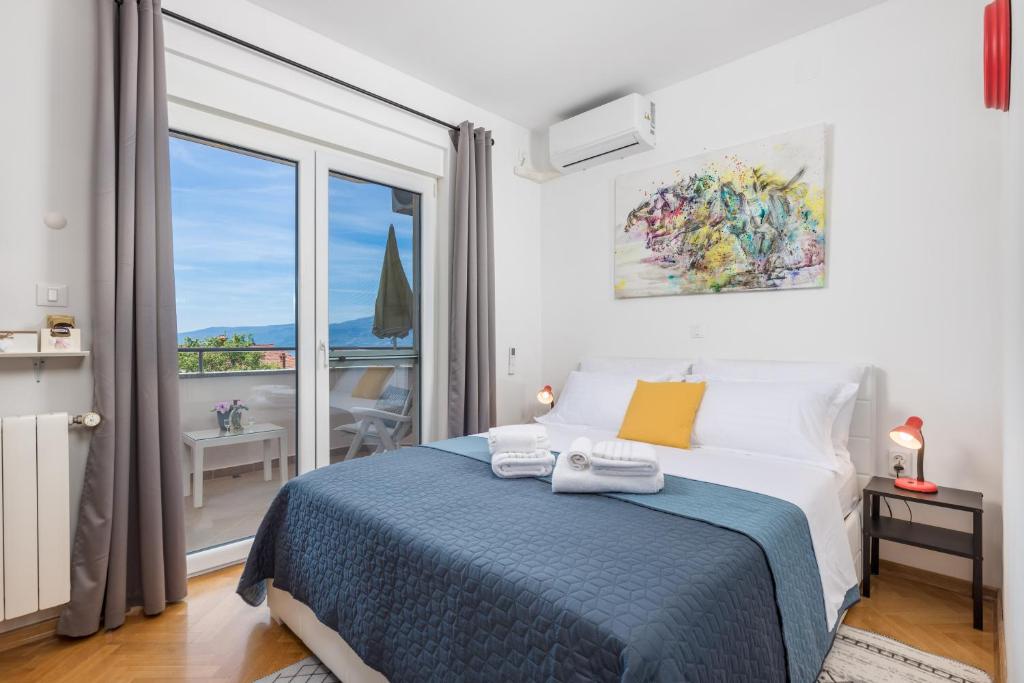 a bedroom with a bed and a large window at My Way room, parking, sea view, terrace in Rijeka