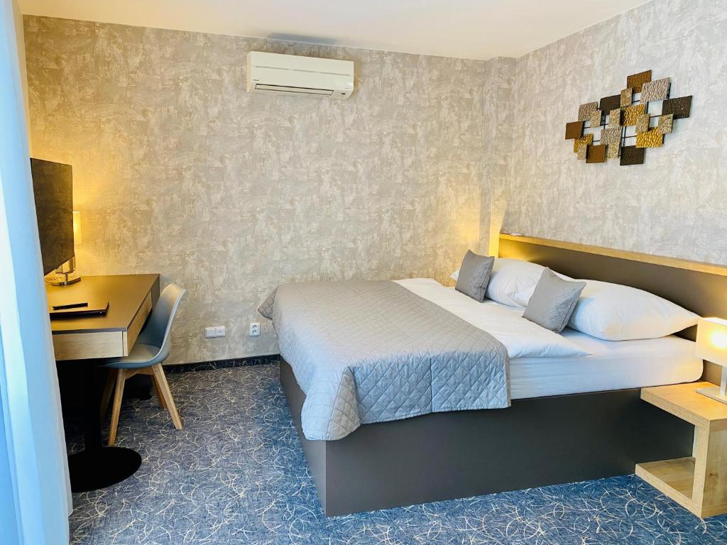 Postel nebo postele na pokoji v ubytování Hotel Mlynska