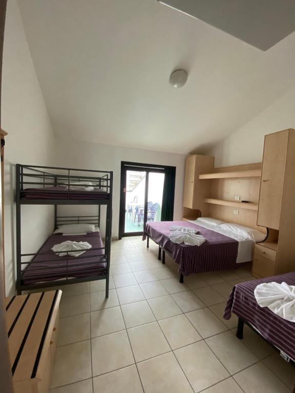 Postel nebo postele na pokoji v ubytování Hotel Aldebaran