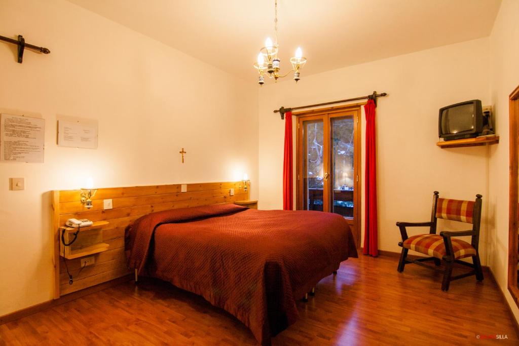 Postel nebo postele na pokoji v ubytování Hotel Garnì Mille Pini