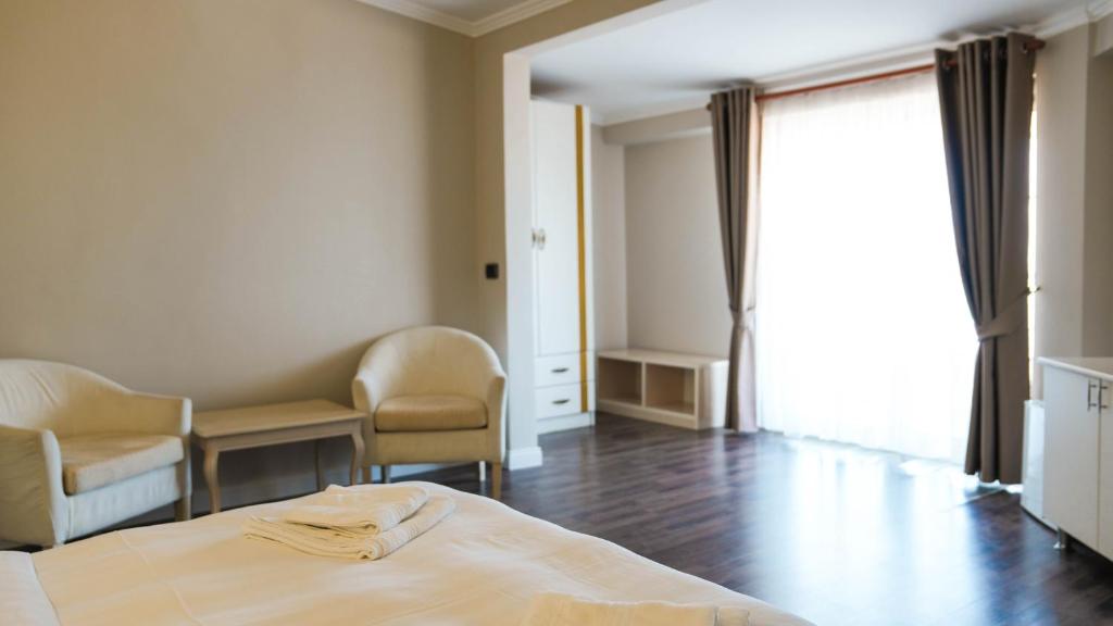 Postel nebo postele na pokoji v ubytování Hotel Majestic