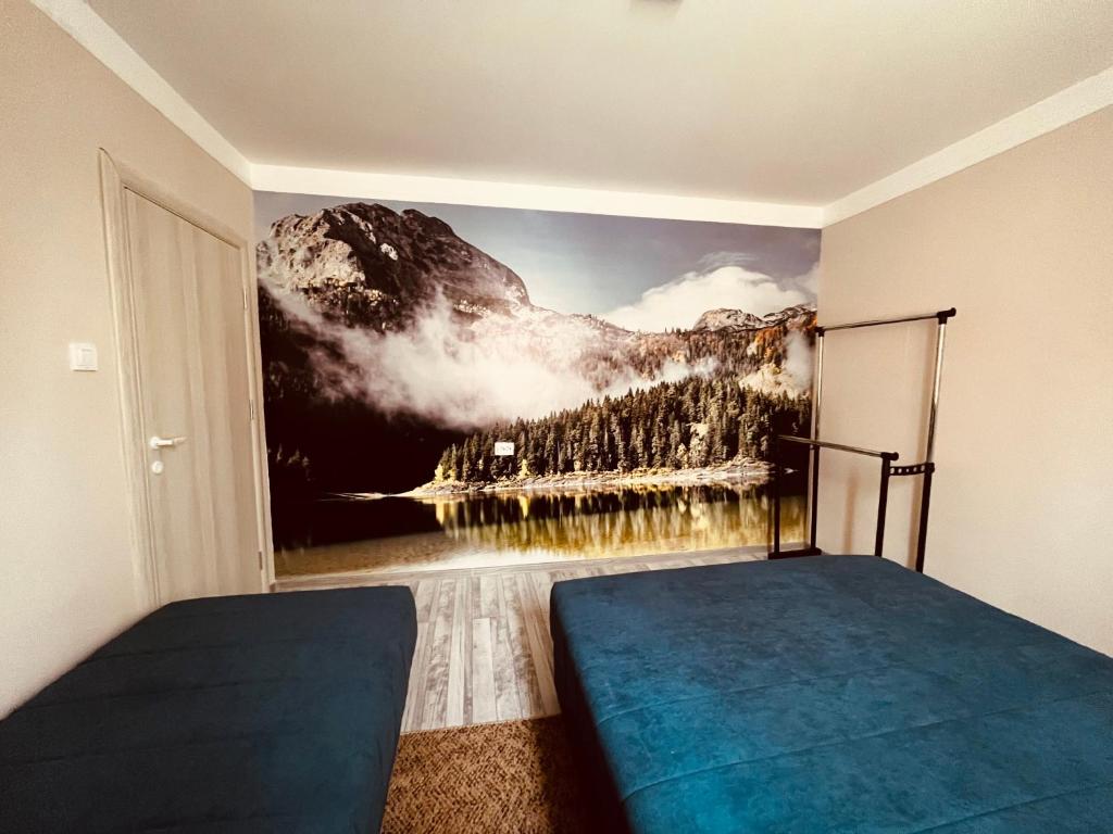 Postel nebo postele na pokoji v ubytování SNAM Rooms&Apartment