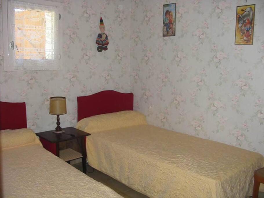 Postel nebo postele na pokoji v ubytování Gîte Saint Michel 2 étoiles