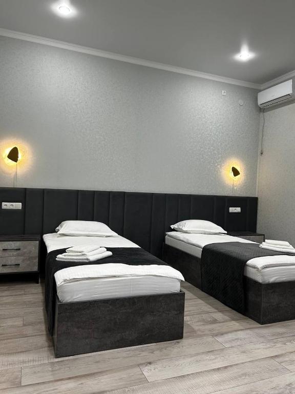 Postel nebo postele na pokoji v ubytování JETISY COMPLEX