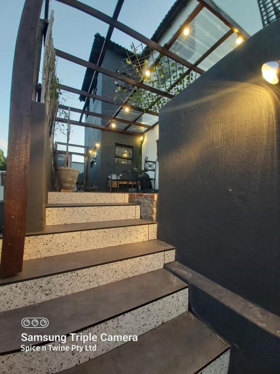 a set of stairs leading up to a house at Harbour Delight & Harbour Comfort in Cape Town