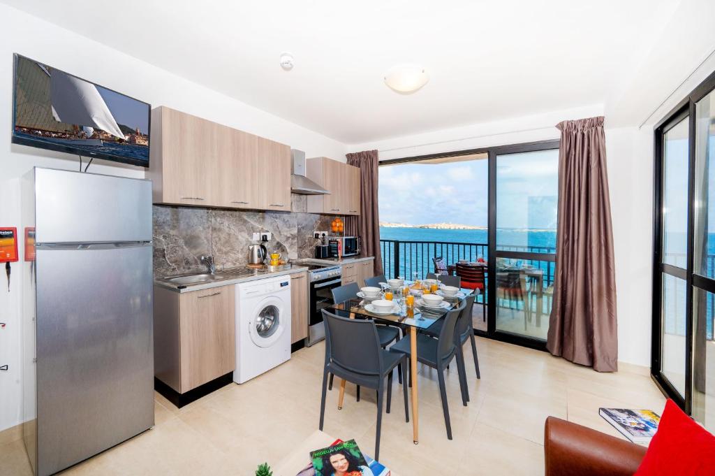 Islet Promenade Seafront Apartment with large Corner Terrace by Getawaysmalta - 1