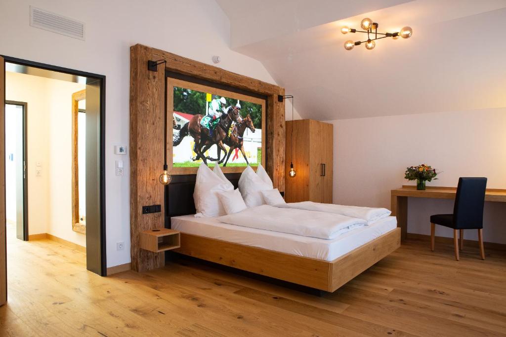 a bedroom with a bed with a horse jumping out the window at Gasthof & Hotel Bichler in Emmering