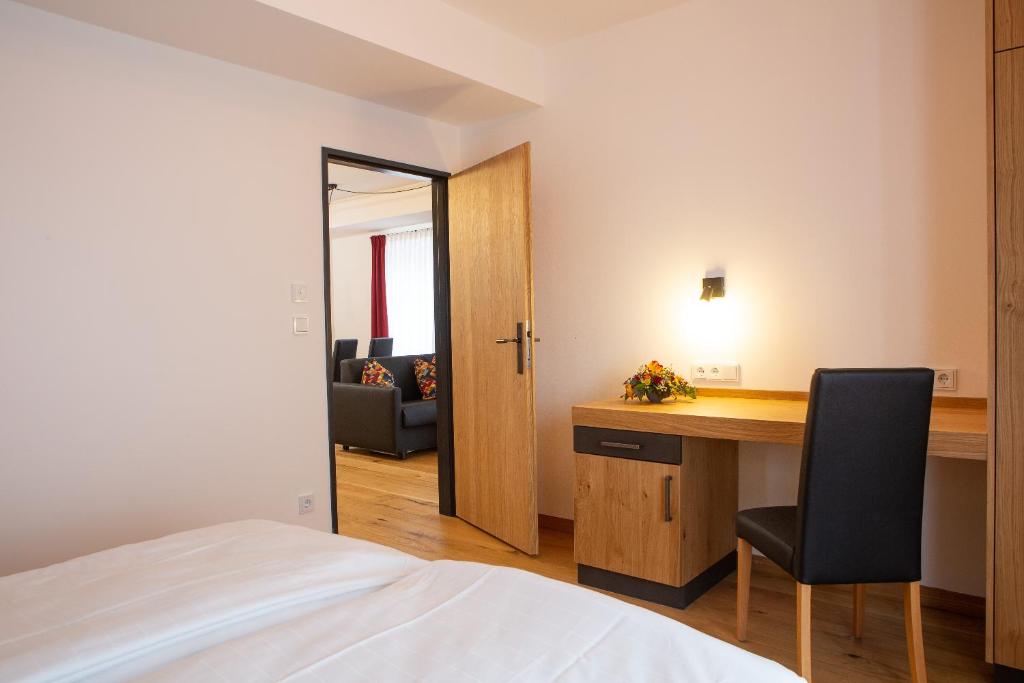 Postel nebo postele na pokoji v ubytování Gasthof & Hotel Bichler