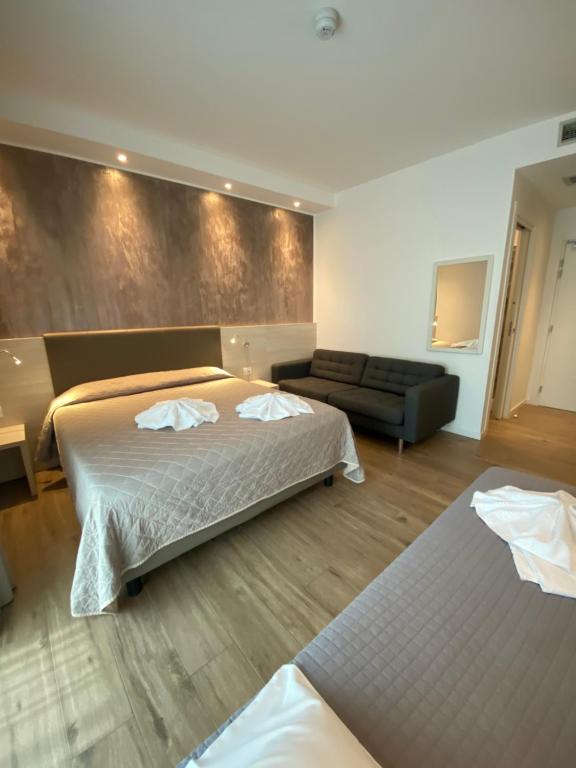 Postel nebo postele na pokoji v ubytování Hotel Aldebaran