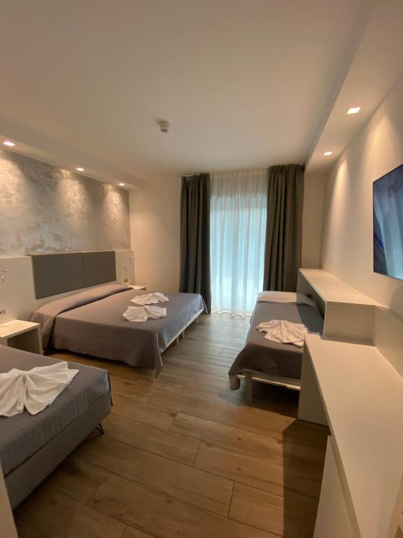 Postel nebo postele na pokoji v ubytování Hotel Aldebaran