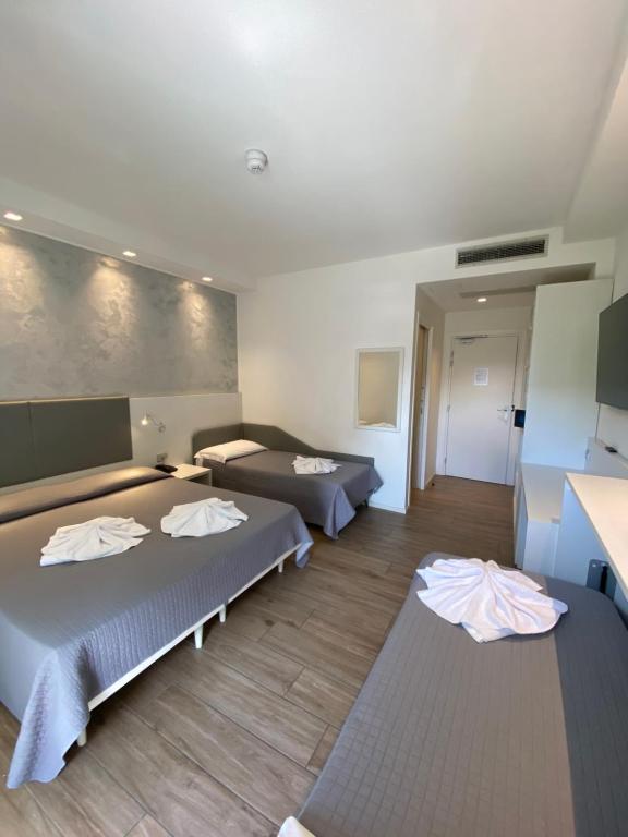 Postel nebo postele na pokoji v ubytování Hotel Aldebaran