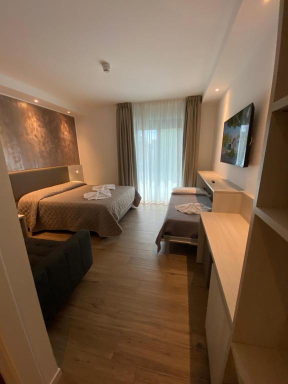 Postel nebo postele na pokoji v ubytování Hotel Aldebaran