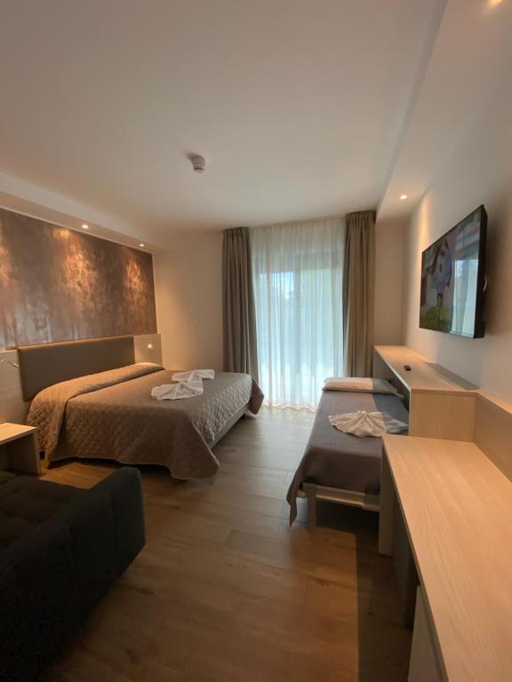 Postel nebo postele na pokoji v ubytování Hotel Aldebaran