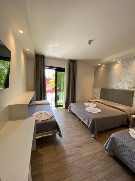 Postel nebo postele na pokoji v ubytování Hotel Aldebaran