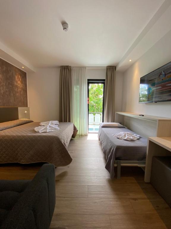 Postel nebo postele na pokoji v ubytování Hotel Aldebaran