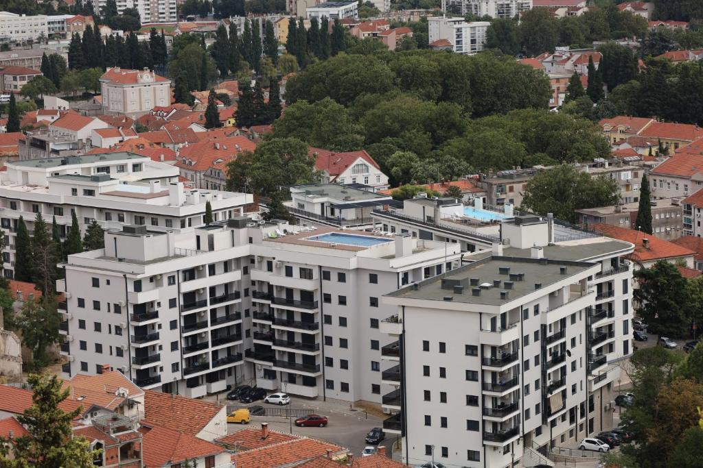 an overhead view of a city with white buildings at Trebinje Lux Apartment in Trebinje