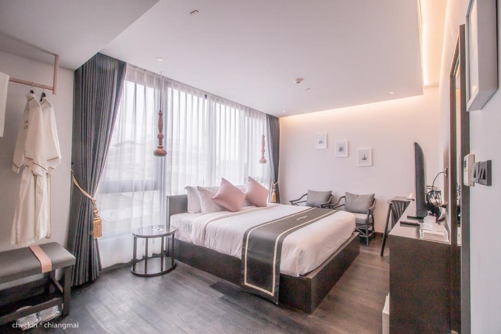 Postel nebo postele na pokoji v ubytování SOOKNIRUND HOTEL