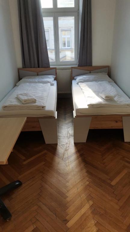 Postel nebo postele na pokoji v ubytování Speedyrooms Vienna