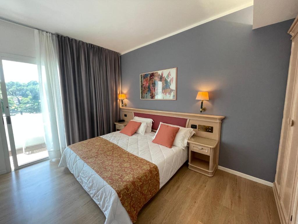 Postel nebo postele na pokoji v ubytování Park Hotel Cellini