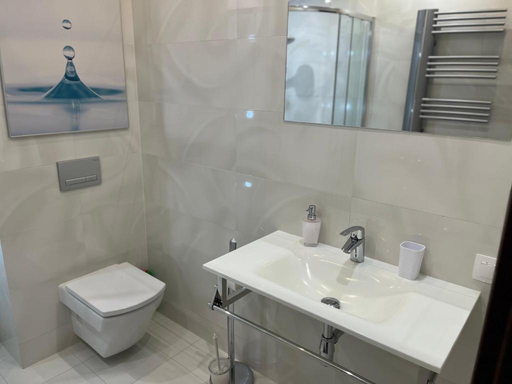 Kúpeľňa v ubytovaní Apartament Esensja II