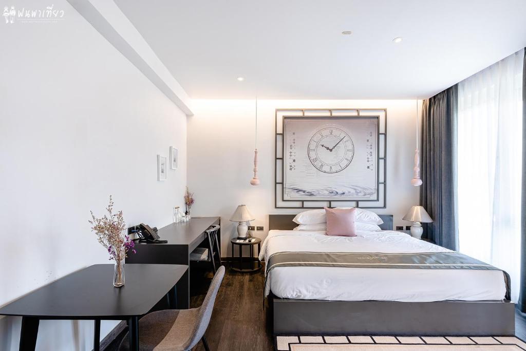 Postel nebo postele na pokoji v ubytování SOOKNIRUND HOTEL