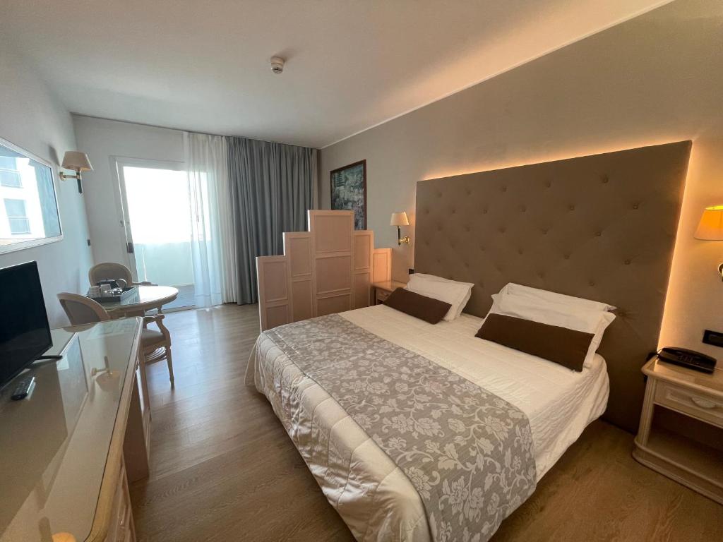Postel nebo postele na pokoji v ubytování Park Hotel Cellini