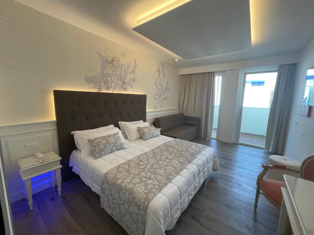 Postel nebo postele na pokoji v ubytování Park Hotel Cellini