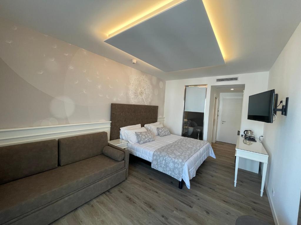 Postel nebo postele na pokoji v ubytování Park Hotel Cellini